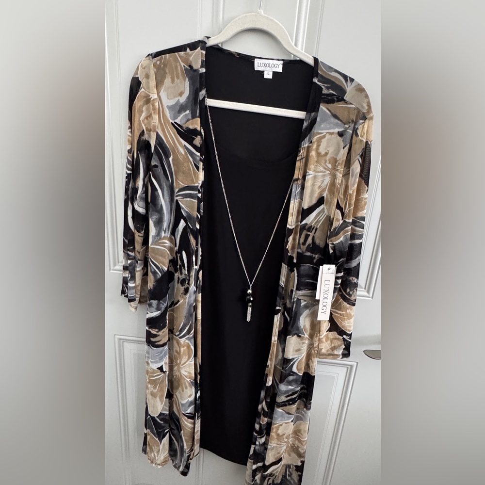 NWT. Long sleeved dress. Cardigan is attached. Necklace is attached. Size L.